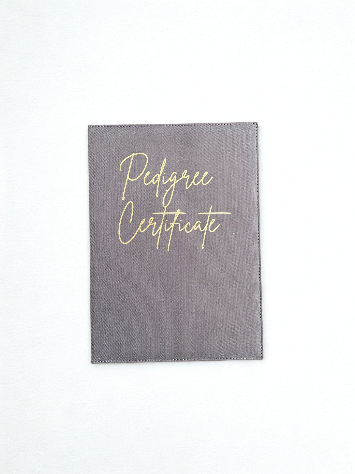 Gray cover with 'Pedigree Certificate' text on a white background