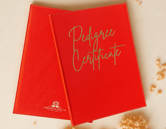 Two red 'Pedigree Certificate' books on a light background