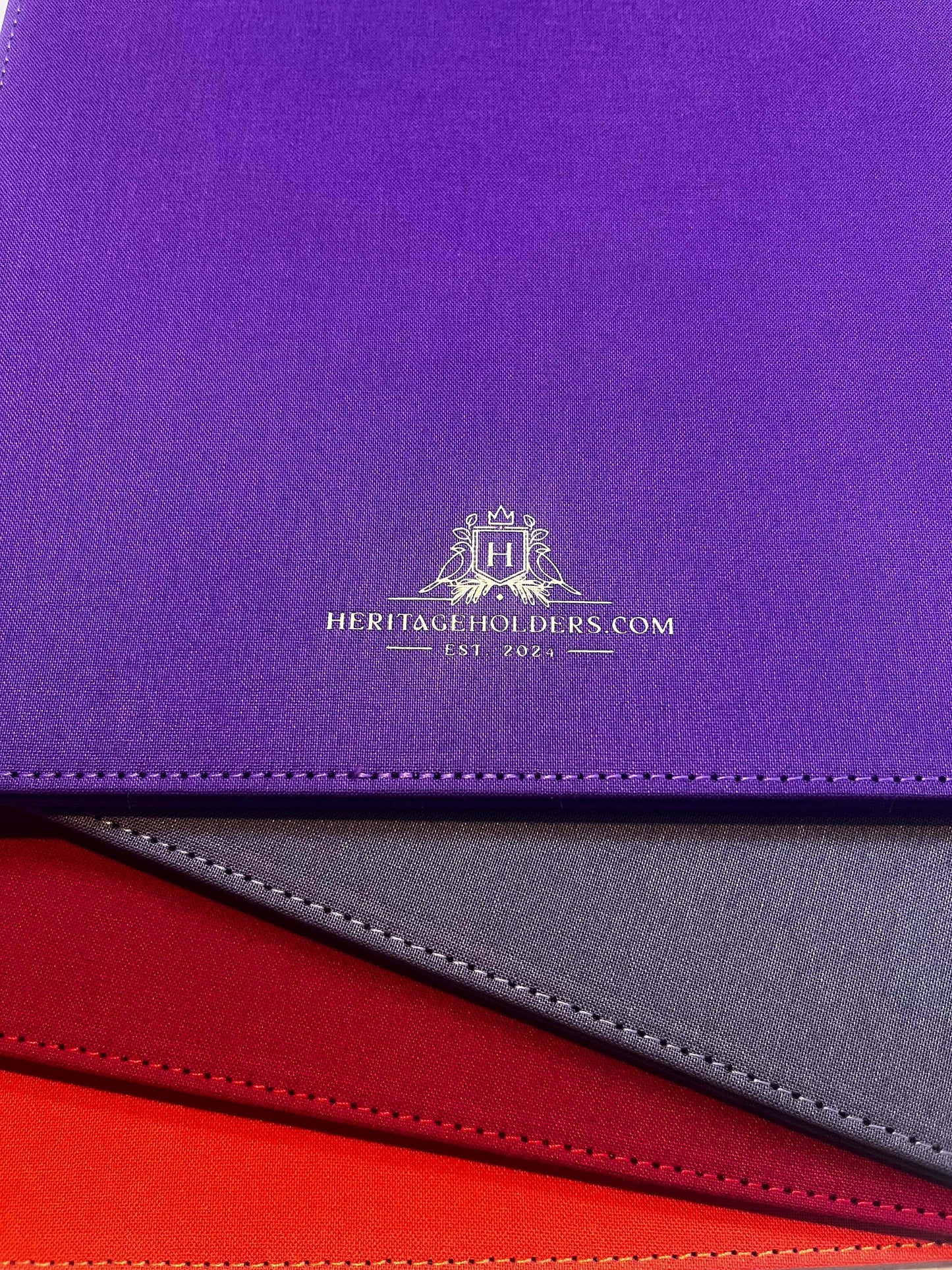 Close-up of a purple surface with a logo and text, featuring a gradient effect.